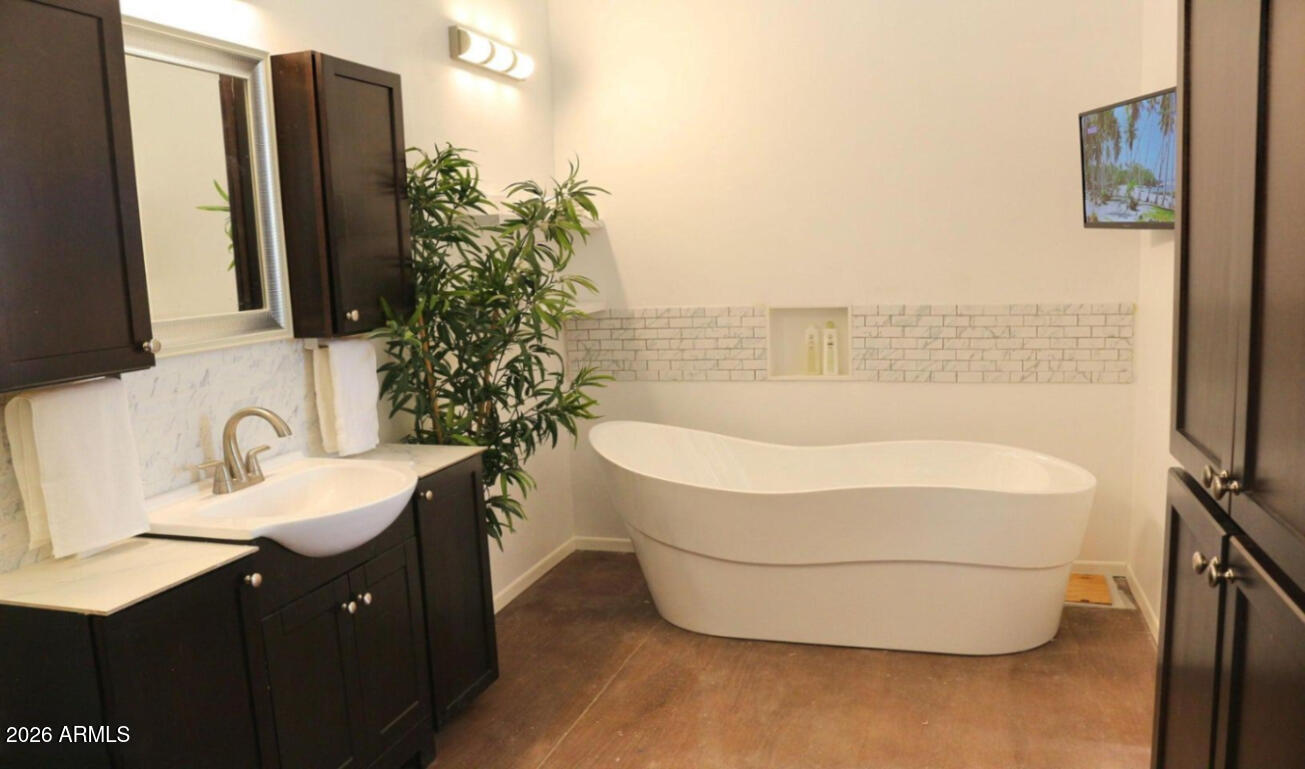 12 County Road Snowflake, AZ 85937 - Photo 20 of 85 a bathroom with a sink and mirror