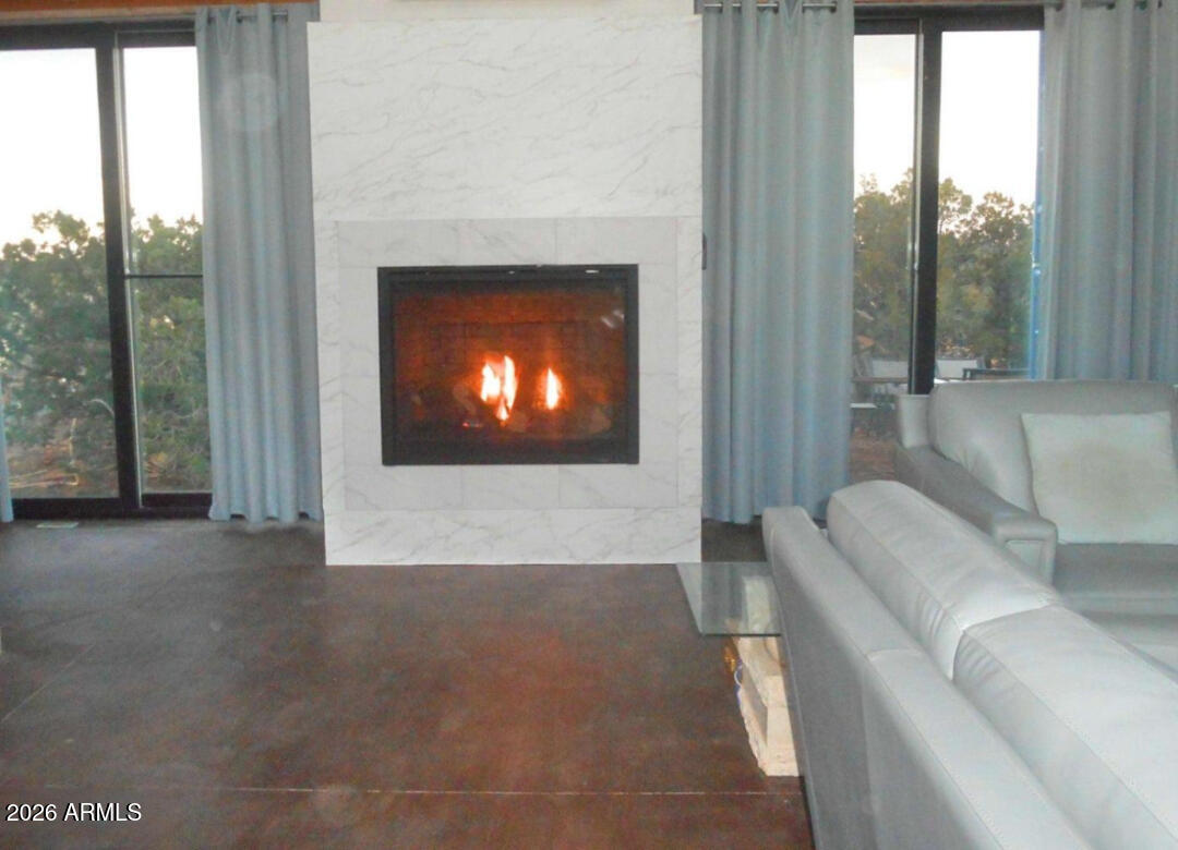12 County Road Snowflake, AZ 85937 - Photo 10 of 85 a living room with furniture and a fireplace