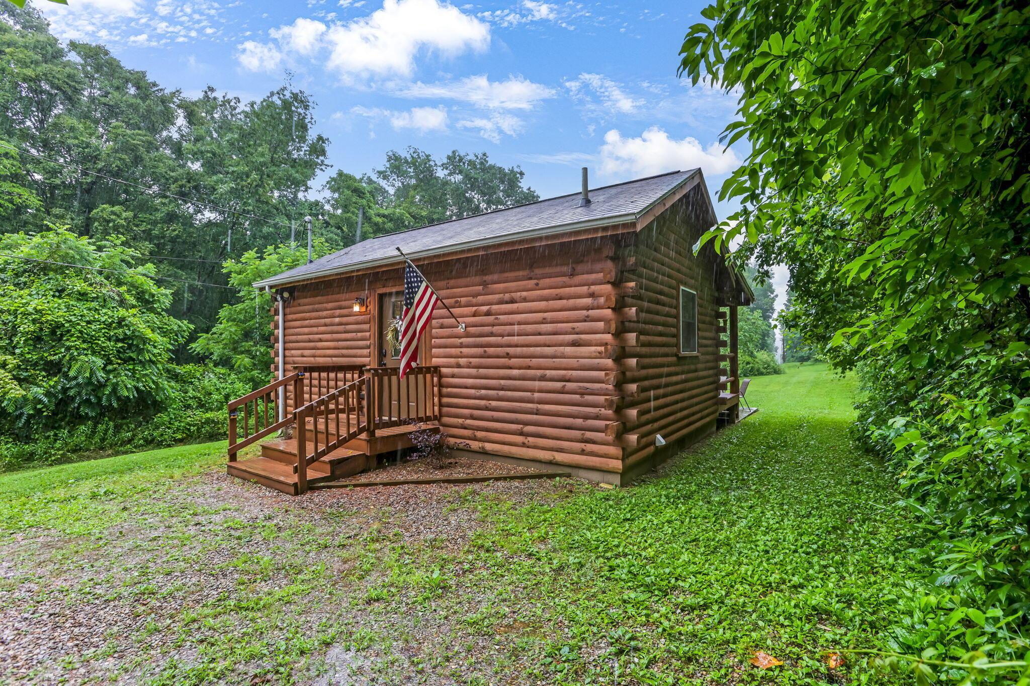 14879 Wolfe-Bennett Road Nelsonville, OH 45764 - Photo 2 of 31 Front of Log Home