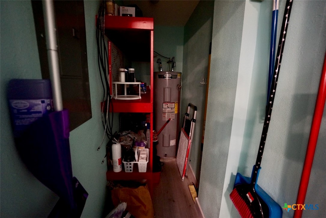 811 Main Street Port O'Connor, TX 77982 - Photo 20 of 36 a view of walk in closet with clothes and shoes