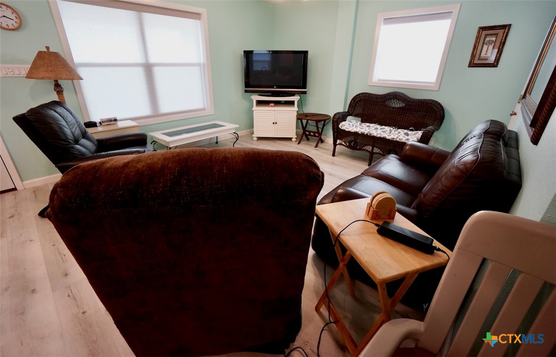 811 Main Street Port O'Connor, TX 77982 - Photo 21 of 36 a bedroom with furniture and a flat screen tv