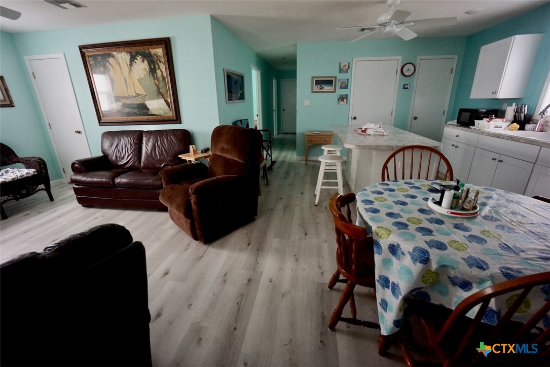 811 Main Street Port O'Connor, TX 77982 - Photo 31 of 36 a living room with furniture and wooden floor