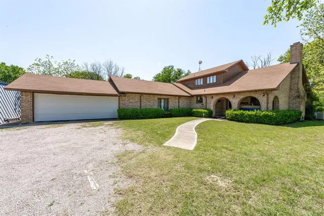 a view of house with outdoor space and porch