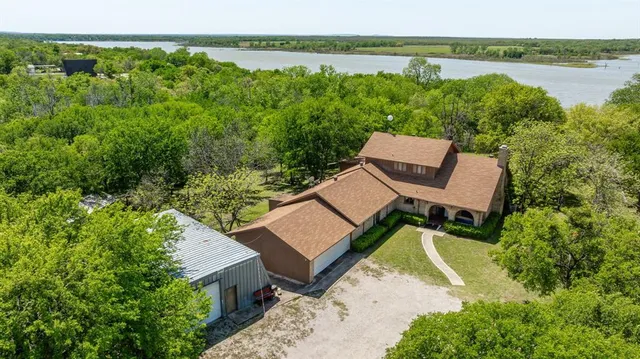 a view of a patio with furniture and garden