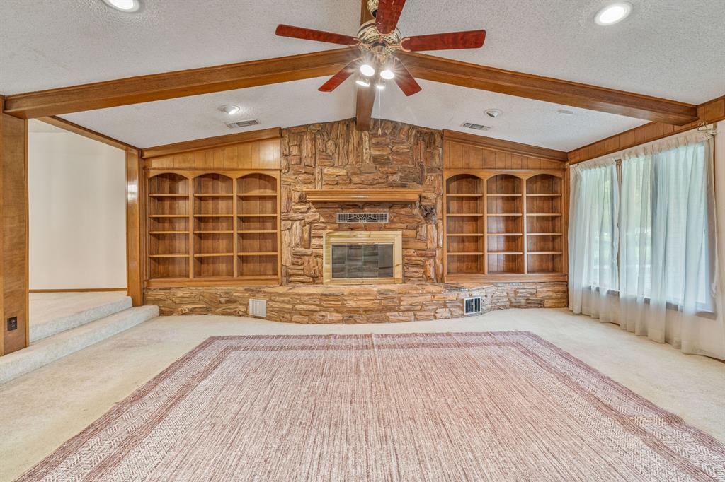 317 Peach Street Dublin, TX 76446 - Photo 27 of 38 a view of an empty room with a window and wooden floor