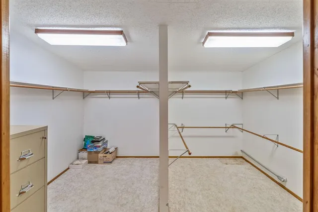 a view of a room with rack on the wall and a window