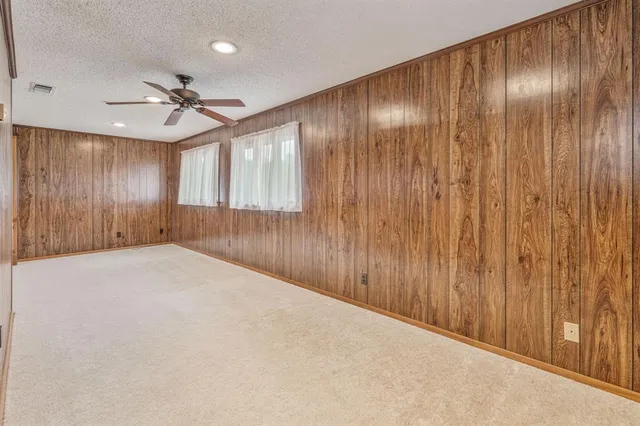 a view of an empty room and a window