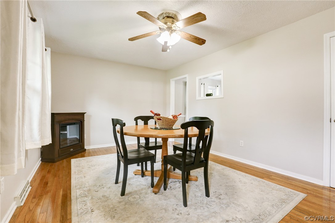 6723 Cherry Road Quinton, VA 23141 - Photo 12 of 44 a view of a dining room with furniture and wooden floor