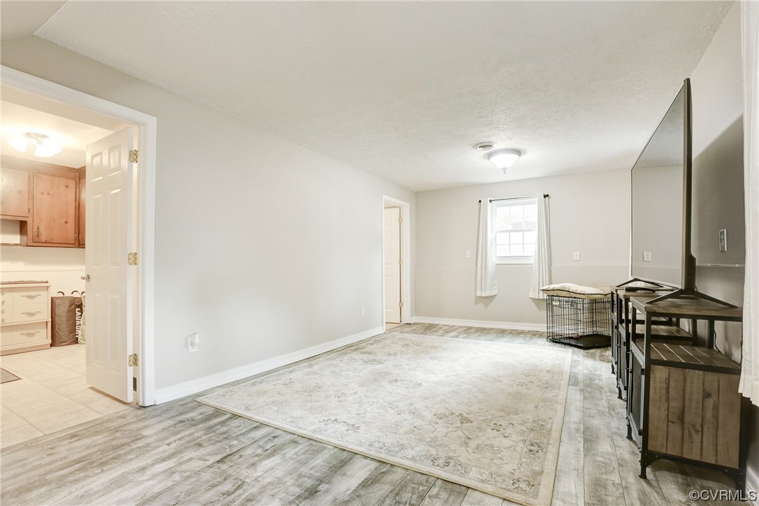 6723 Cherry Road Quinton, VA 23141 - Photo 15 of 44 a bedroom with a bed and a view of kitchen
