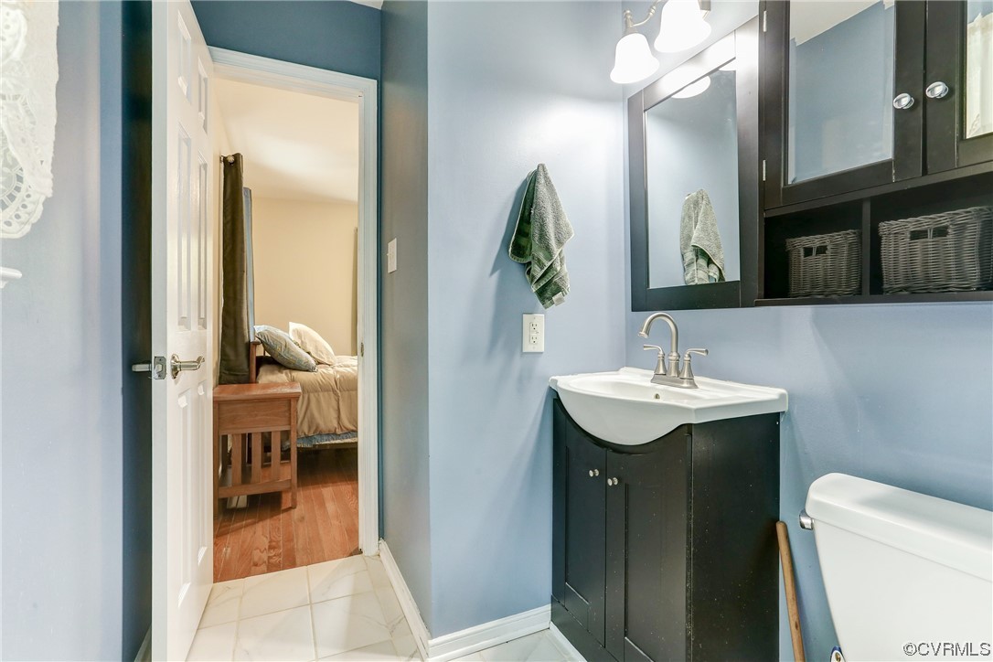 6723 Cherry Road Quinton, VA 23141 - Photo 21 of 44 a bathroom with a sink and a mirror