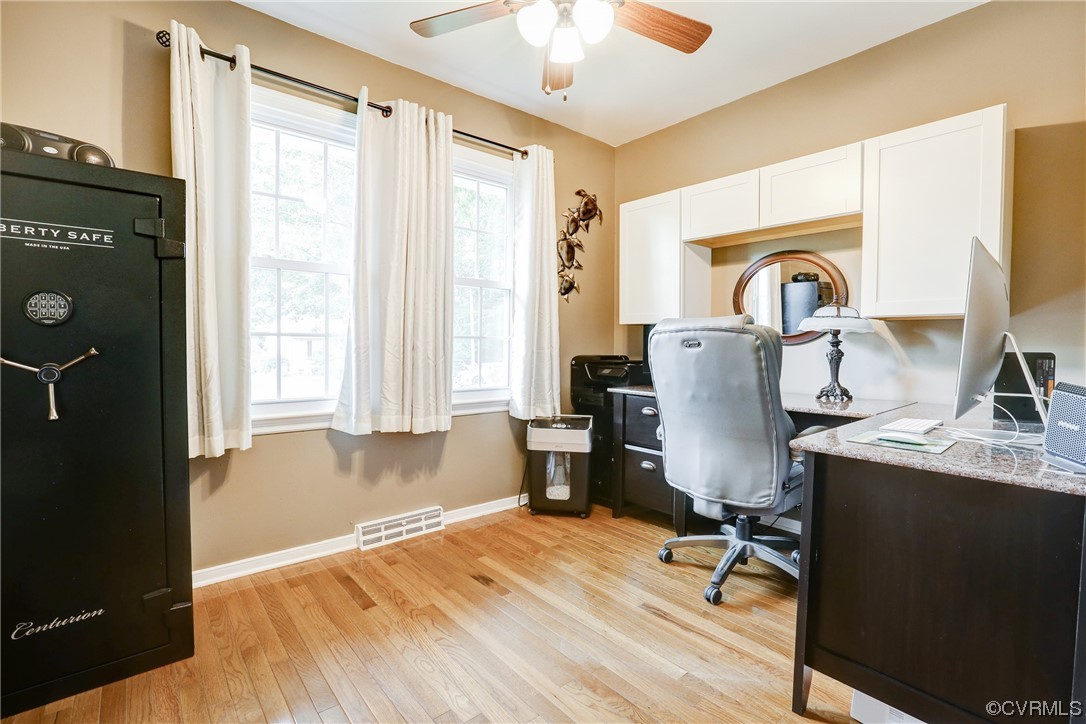 6723 Cherry Road Quinton, VA 23141 - Photo 24 of 44 a view of a workspace with furniture and a window