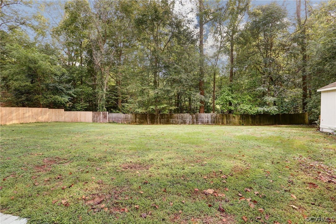 6723 Cherry Road Quinton, VA 23141 - Photo 29 of 44 a view of a field with trees in the background