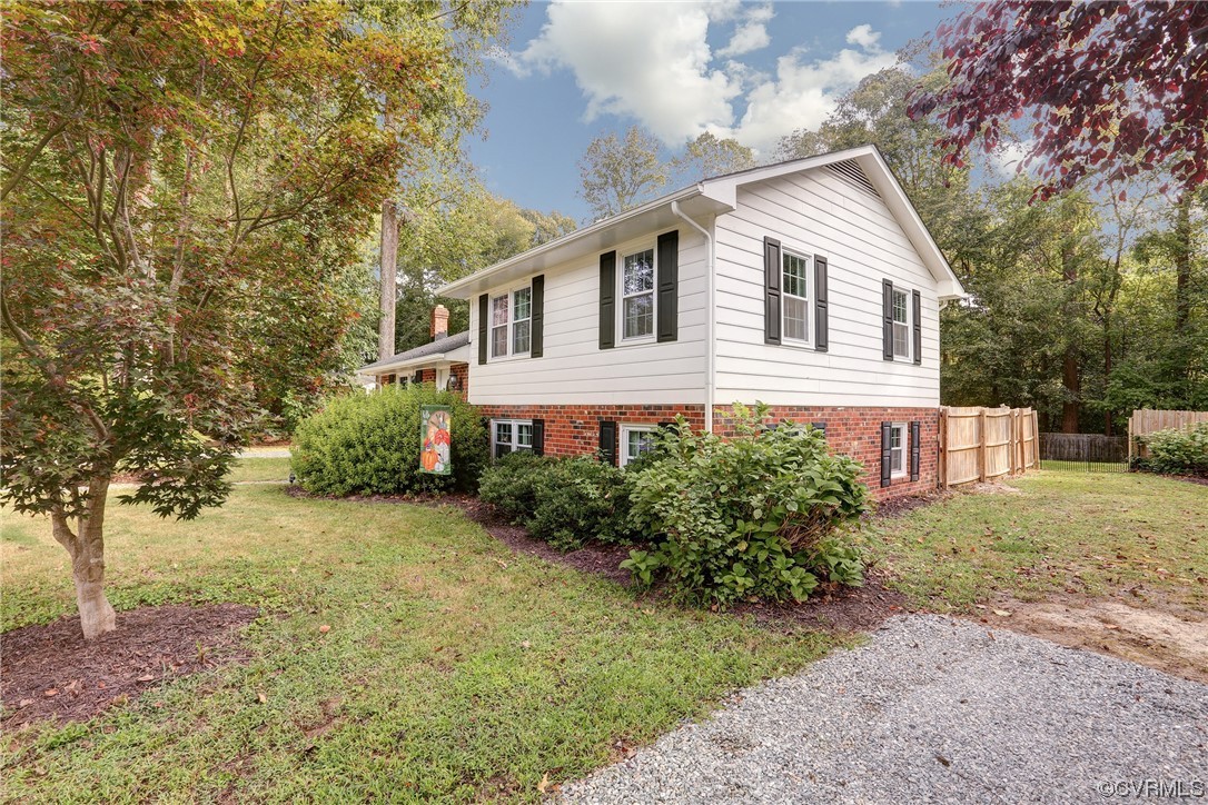 6723 Cherry Road Quinton, VA 23141 - Photo 33 of 44 a white house that has a tree in front of it