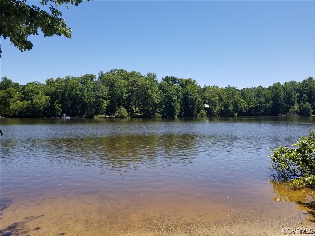 6723 Cherry Road Quinton, VA 23141 - Photo 38 of 44 a view of a lake with houses in the background