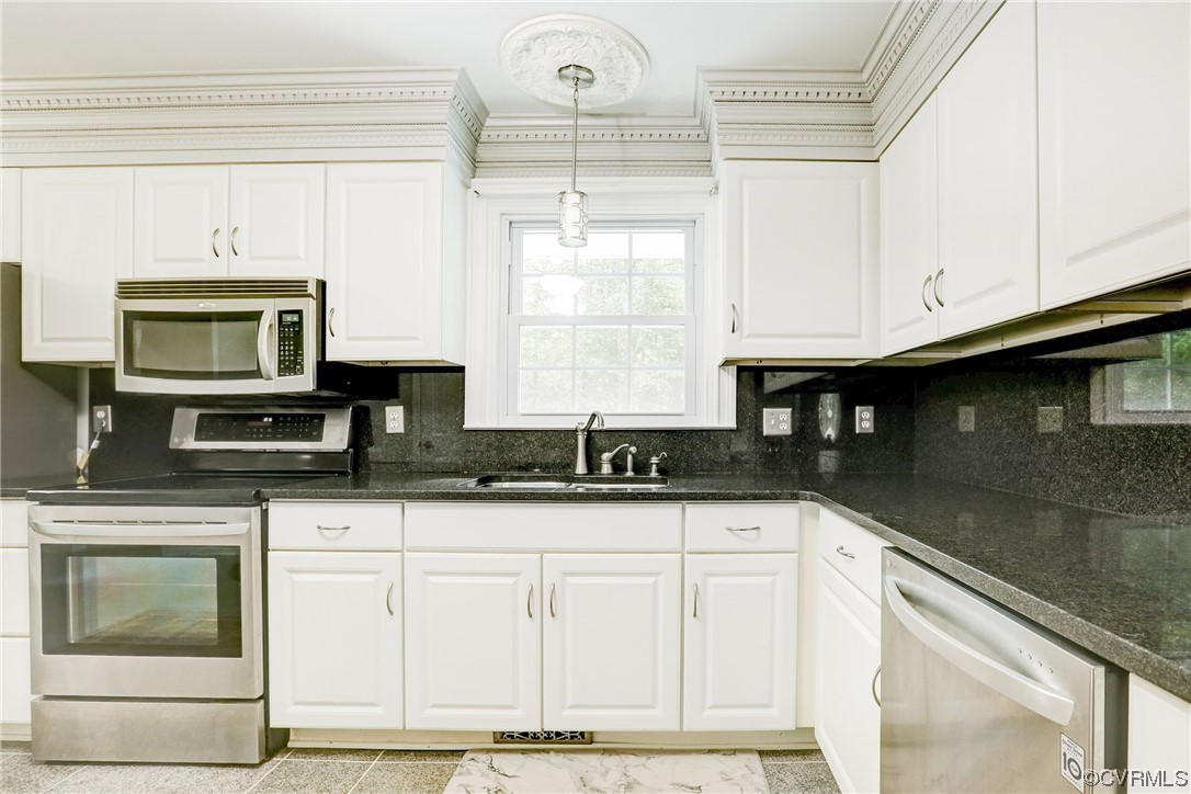 6723 Cherry Road Quinton, VA 23141 - Photo 6 of 44 a kitchen with granite countertop white cabinets and window