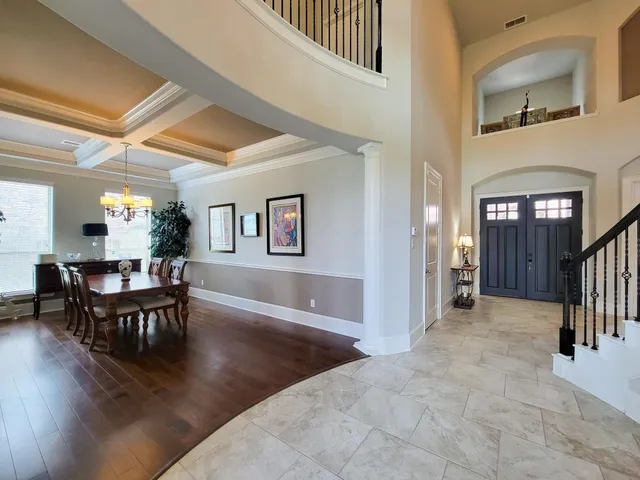 a view of a livingroom with furniture and entryway window