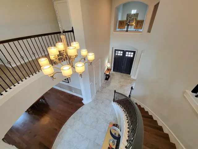a view of staircase with a rug