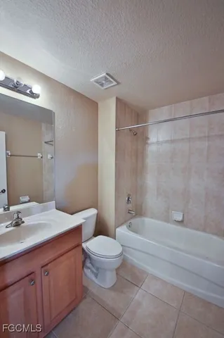 an empty room with a ceiling fan and a window