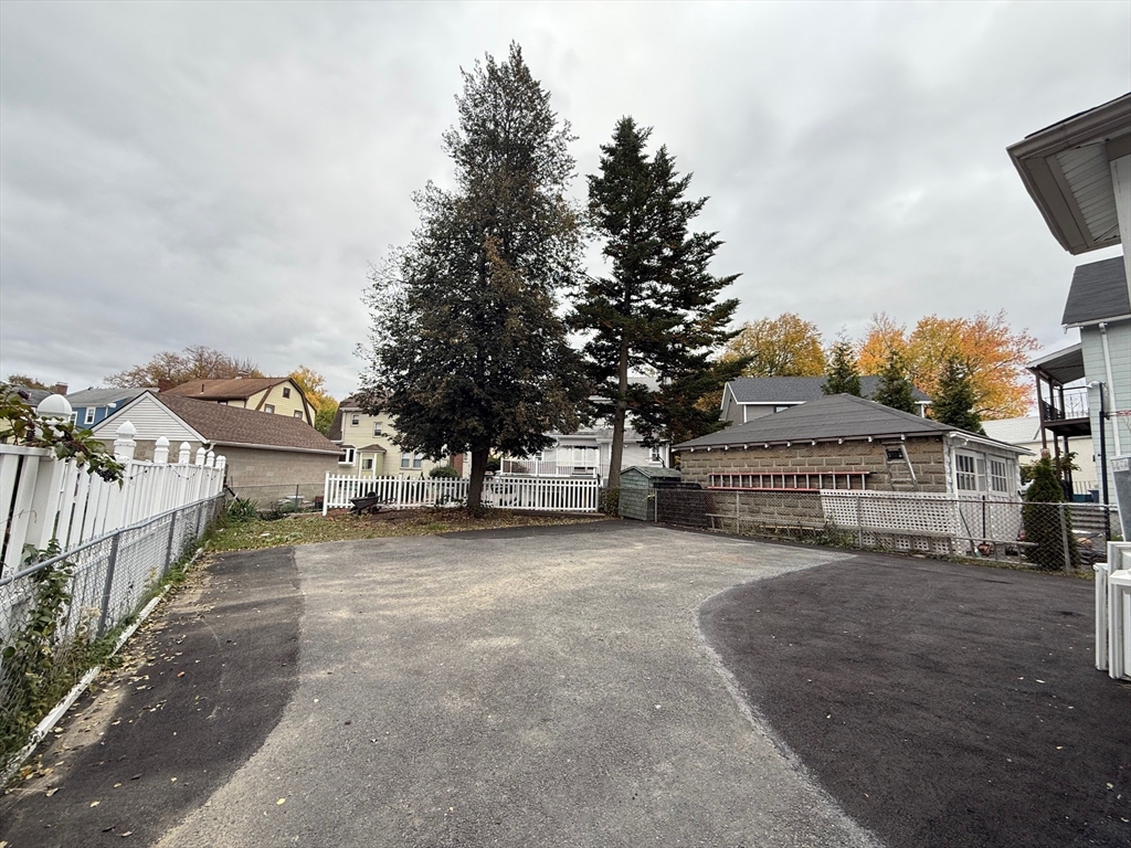 224 Faneuil Street, Unit 1 Boston, MA 02135 - Photo 17 of 19 a view of a house with a yard