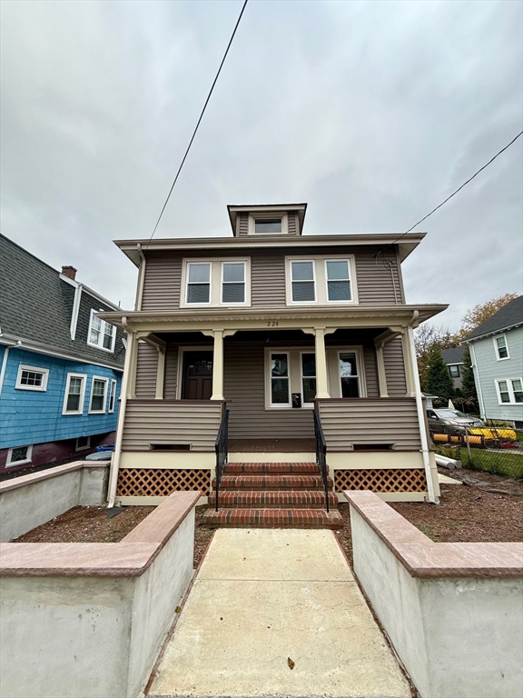 224 Faneuil Street, Unit 1 Boston, MA 02135 - Photo 18 of 19 a view of a house with pool and chairs