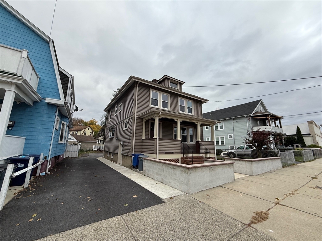 224 Faneuil Street, Unit 1 Boston, MA 02135 - Photo 19 of 19 a view of a building with sitting area