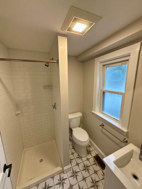 224 Faneuil Street, Unit 1 Boston, MA 02135 - Photo 9 of 19 a bathroom with a sink toilet and shower