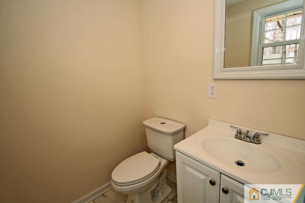305 Chain O' Hills Road Colonia, NJ 07067 - Photo 13 of 20 a white toilet sitting next to a bathroom sink