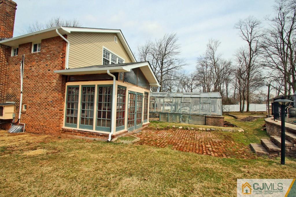305 Chain O' Hills Road Colonia, NJ 07067 - Photo 17 of 20 a view of a house with a yard