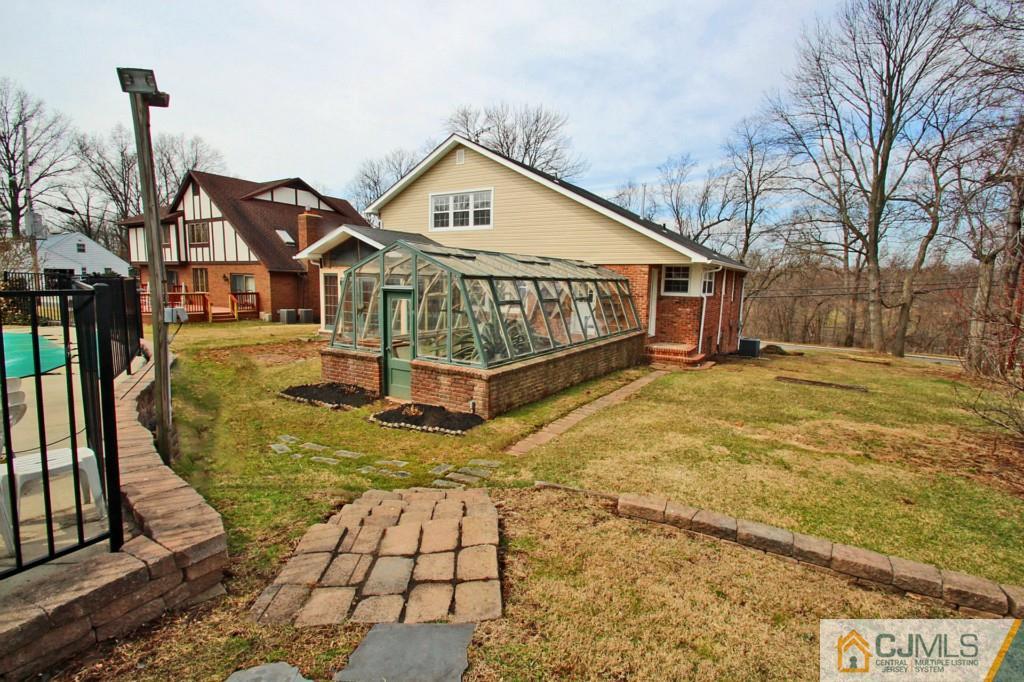 305 Chain O' Hills Road Colonia, NJ 07067 - Photo 20 of 20 a view of a house with a yard