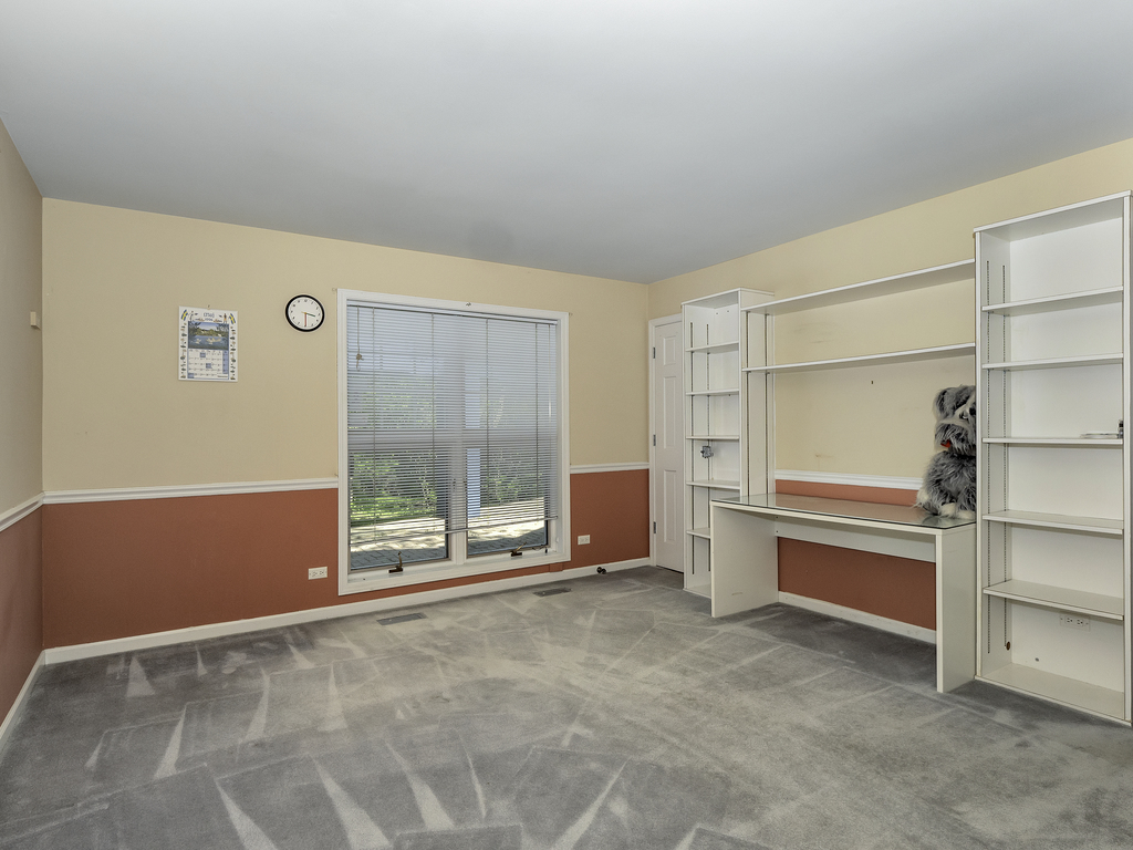 85 Ridgecroft Lane Barrington, IL 60010 - Photo 13 of 53 a view of an empty room with cabinet and windows