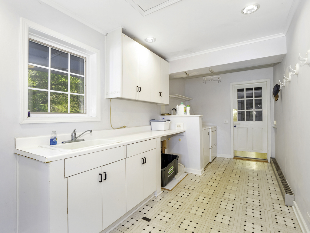 85 Ridgecroft Lane Barrington, IL 60010 - Photo 22 of 53 a kitchen with a sink cabinets appliances and a window