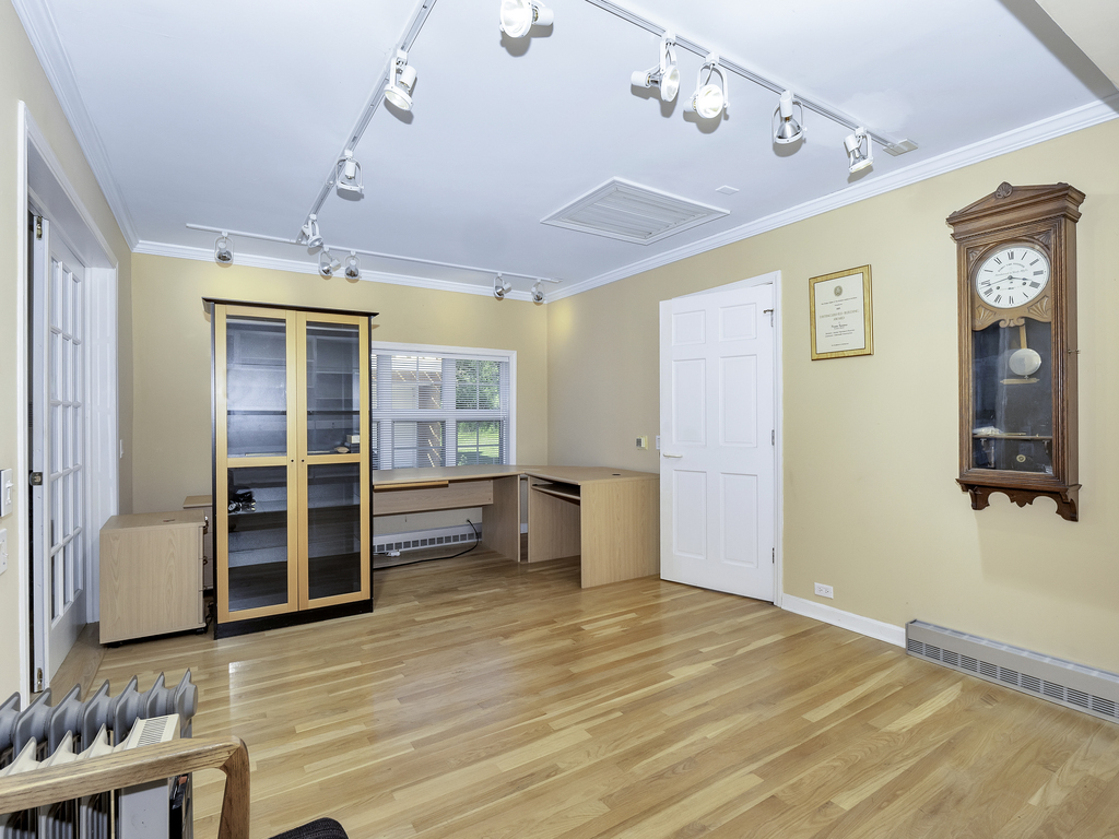 85 Ridgecroft Lane Barrington, IL 60010 - Photo 24 of 53 a view of an empty room with wooden floor and a window