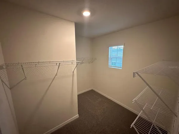 a view of a room with racks on the wall