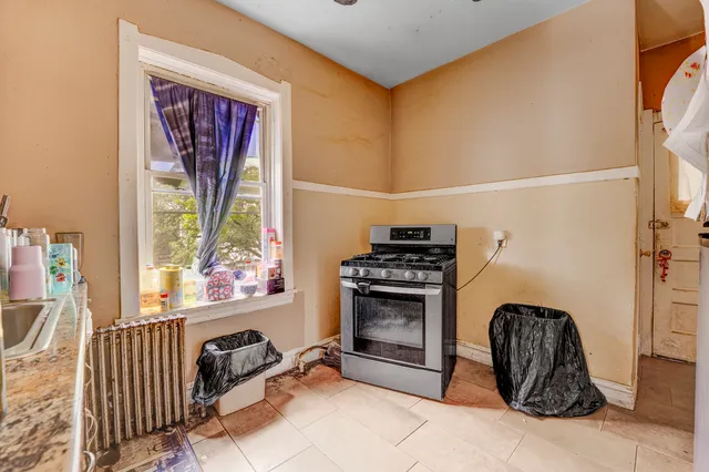 a view of a livingroom with furniture and windows