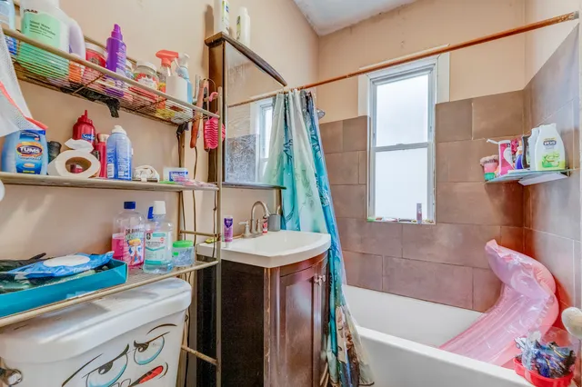 a bathroom with a sink a bath tub and a shower