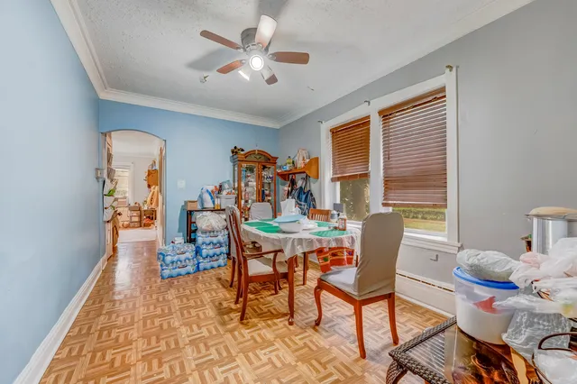 a view of a dining room with furniture window and wooden floor