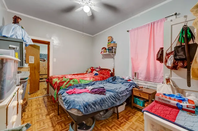 a bedroom with a bed and a dresser