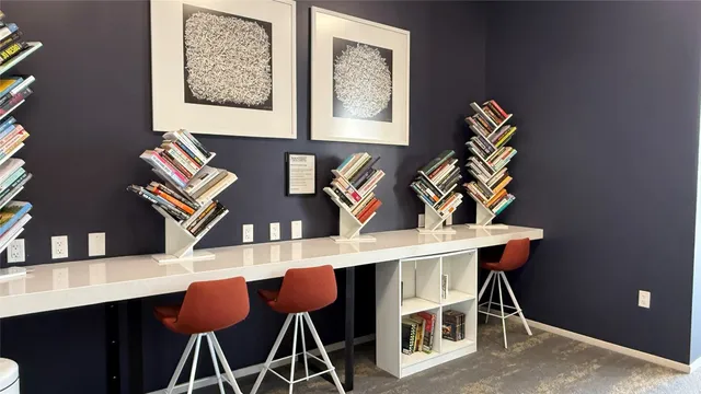 a dining room with furniture window and wooden floor