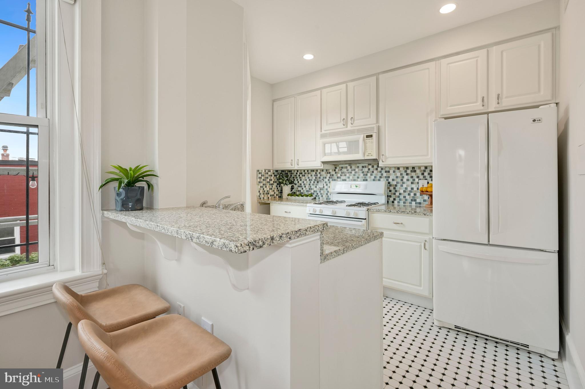 1423 R Street Northwest, Unit 400 Washington, DC 20009 - Photo 9 of 29 Galley Kitchen with lots of light.
