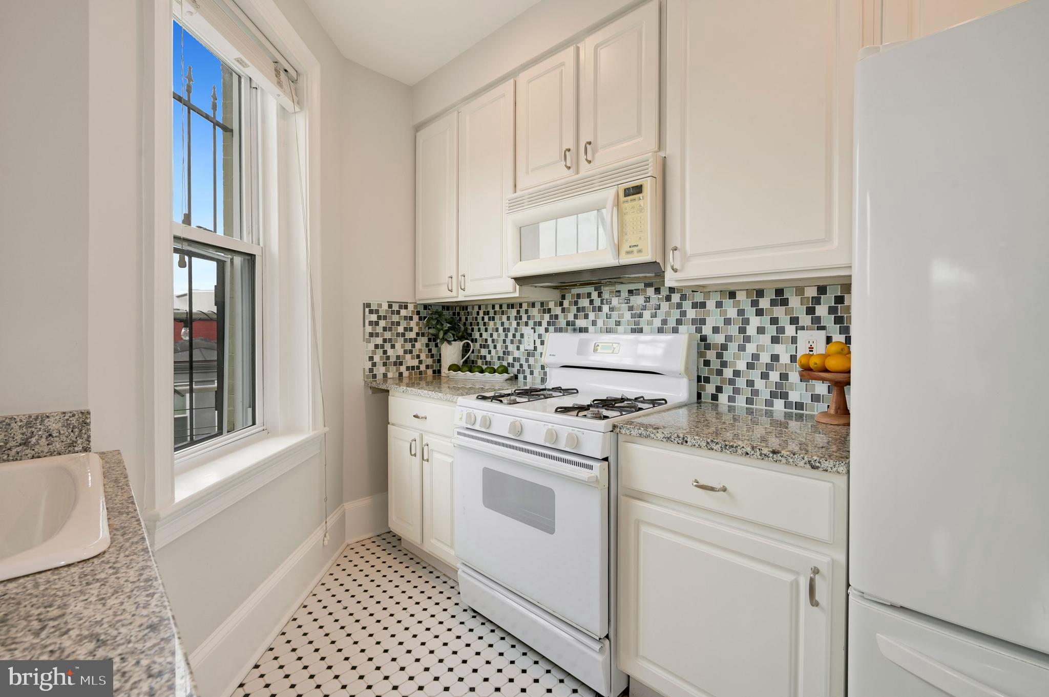 1423 R Street Northwest, Unit 400 Washington, DC 20009 - Photo 10 of 29 Galley Kitchen with lots of light.