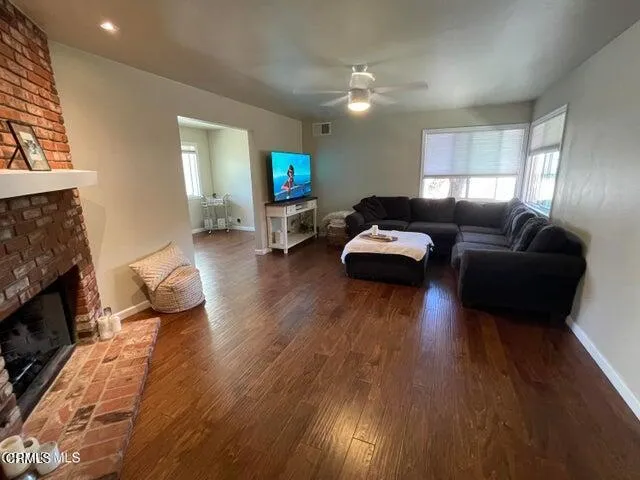 a living room with furniture or couch and a fireplace