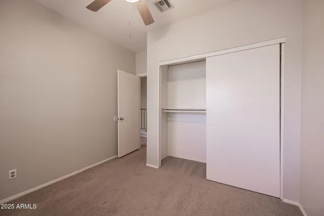 a view of empty room with closet