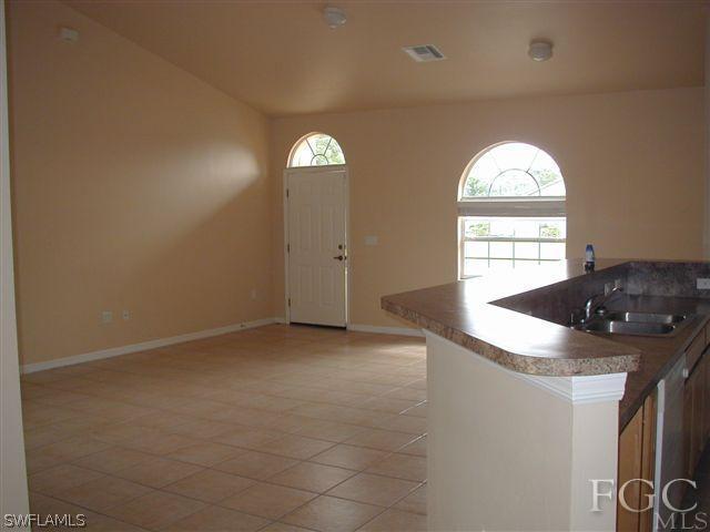 17552 Duquesne Road Fort Myers, FL 33967 - Photo 3 of 10 an empty room with windows