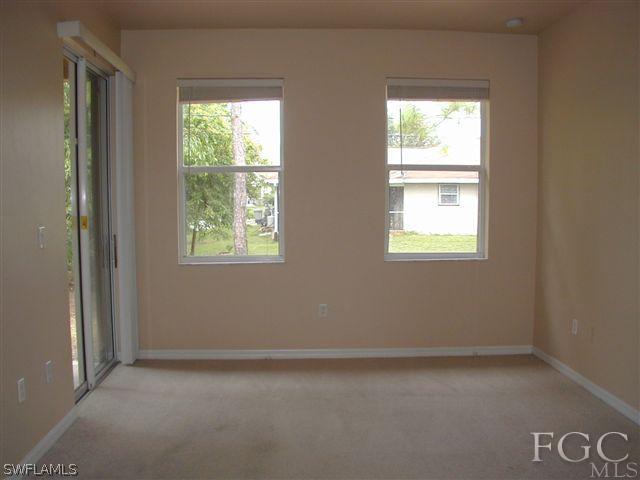 17552 Duquesne Road Fort Myers, FL 33967 - Photo 5 of 10 an empty room with a window