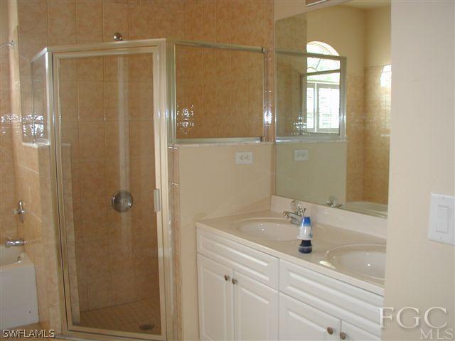 17552 Duquesne Road Fort Myers, FL 33967 - Photo 6 of 10 a bathroom with a bathtub and a sink