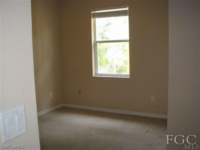 17552 Duquesne Road Fort Myers, FL 33967 - Photo 9 of 10 an empty room with a window