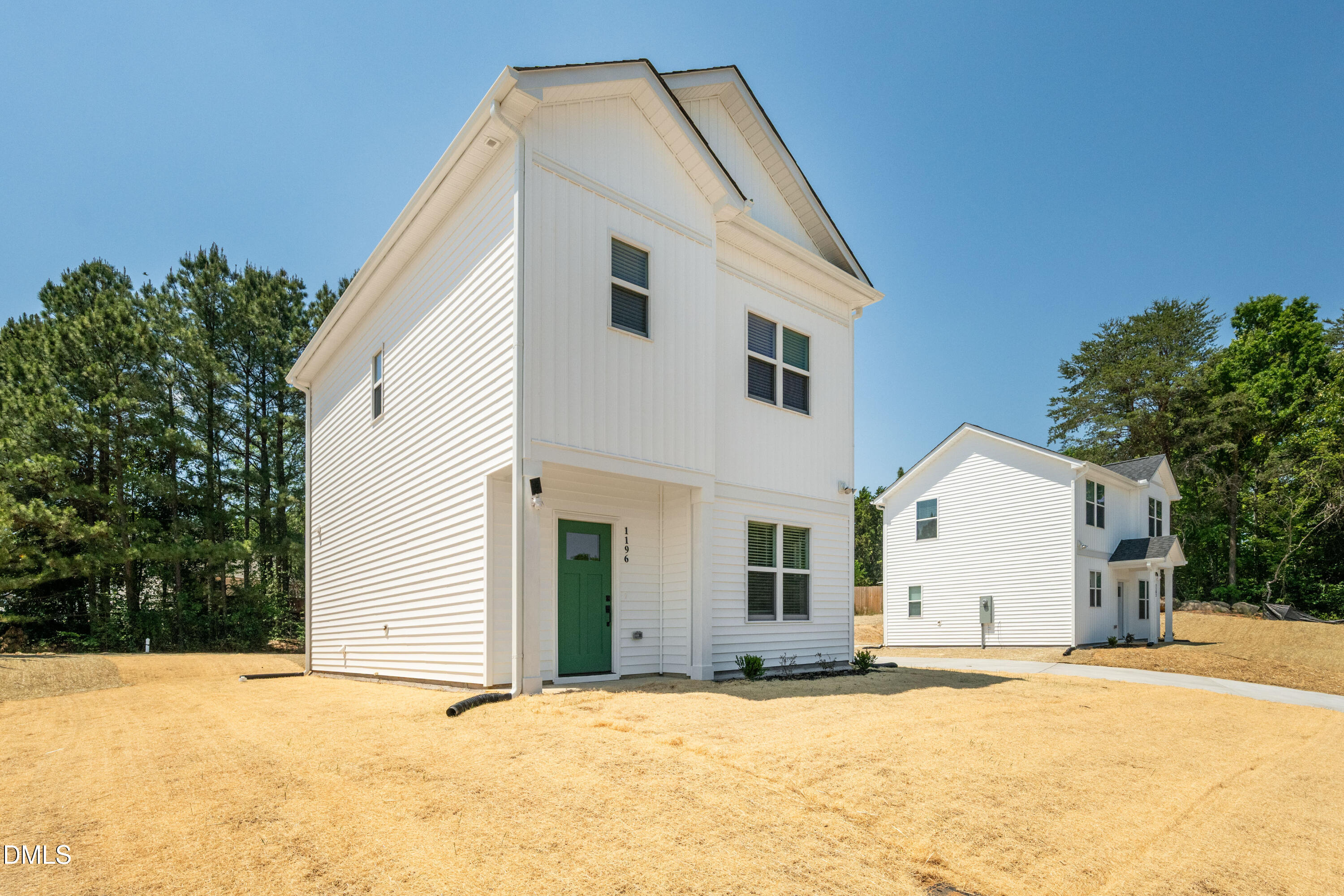 1196 Hurdle Mills Road Roxboro, NC 27573 - Photo 3 of 50 a view of a house with a yard and large tree