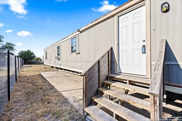 a view of a back yard of the house