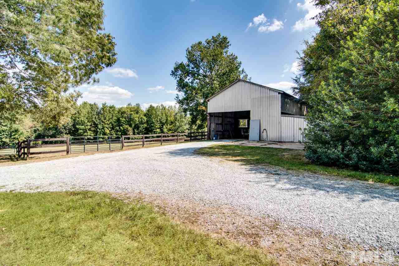 415 Bill Poole Road Rougemont, NC 27572 - Photo 25 of 30 Separate storage area, several stalls