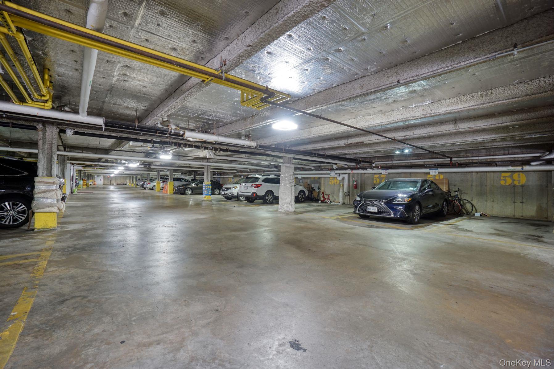 171 Great Neck Road, Unit 1C Great Neck, NY 11021 - Photo 16 of 17 a car parked in parking parking space